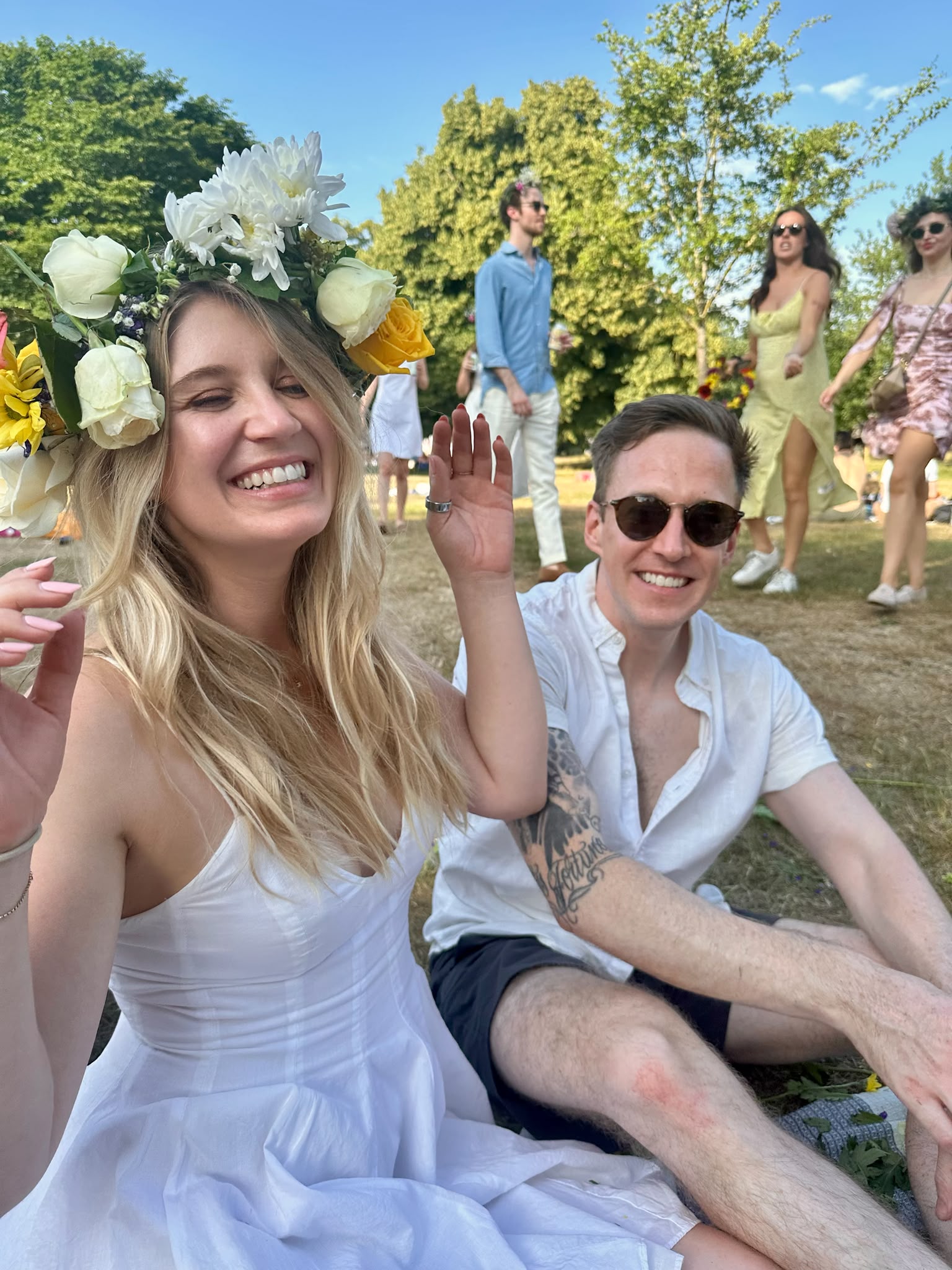 Luther and Alice at an outdoor festival with flowers